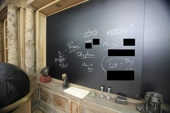Eerie new images from Epstein&rsquo;s private island show a blackboard with cryptic writings and sculptures inside the home.