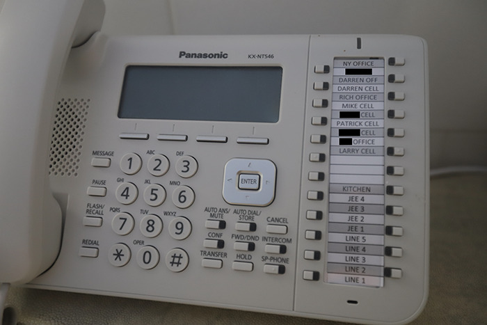 Landline phone with multiple labeled buttons inside Epstein&rsquo;s private island home, showing eerie new images of the interior.