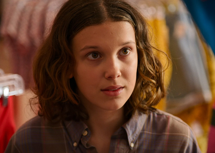 Millie Bobby Brown in a close-up scene from Stranger Things, capturing fans' attention as the shot goes viral online.