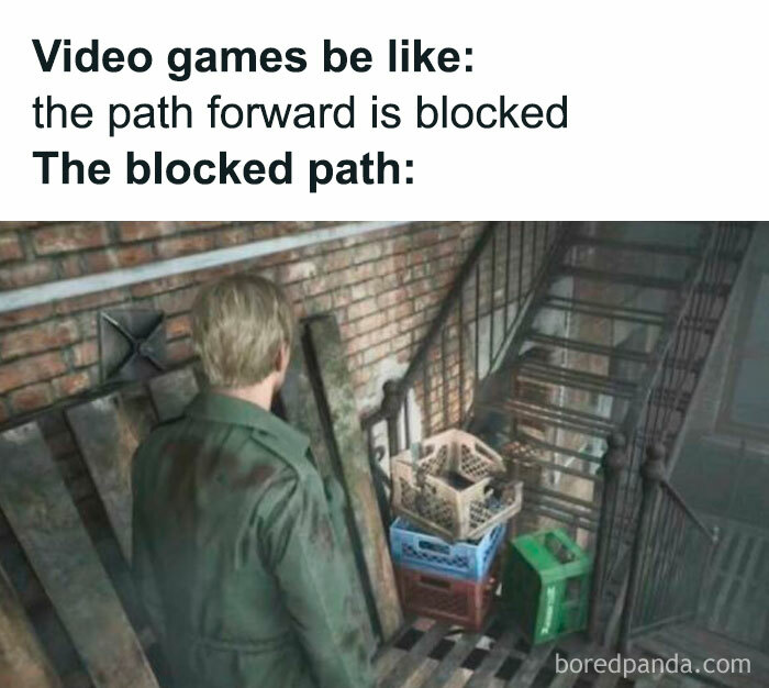 Man in a video game standing in front of a blocked path with crates stacked under a stairwell in a funny meme.