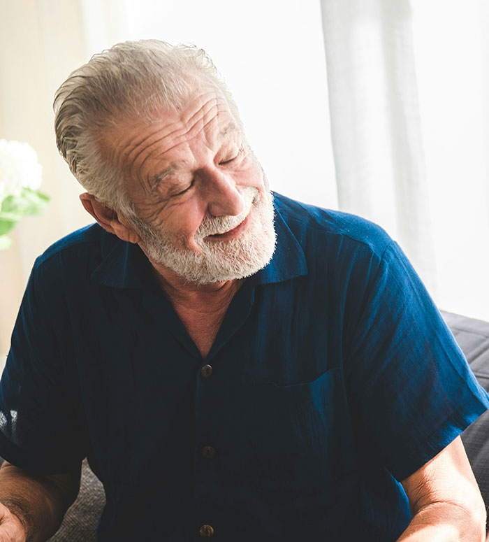 Smiling elderly man enjoying a moment, representing funny things parents said while watching Stranger Things Season 5.