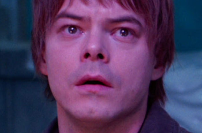 Close-up of a surprised person reacting to Stranger Things season 5, highlighting funny things parents said while watching.