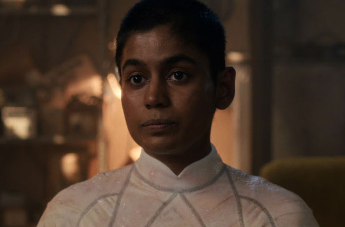 Close-up of a person wearing a white outfit, capturing a scene related to Stranger Things Season 5 reactions.