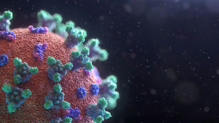 Close-up 3D illustration of a virus particle highlighting surprising life facts at microscopic level in dark space background.