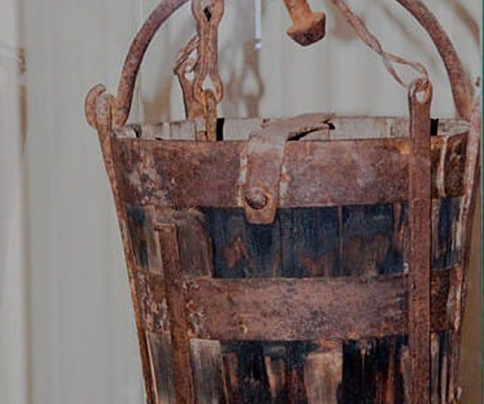 Rusty medieval t*****e device made of wood and metal showing bizarre facts from history and unexpected objects.