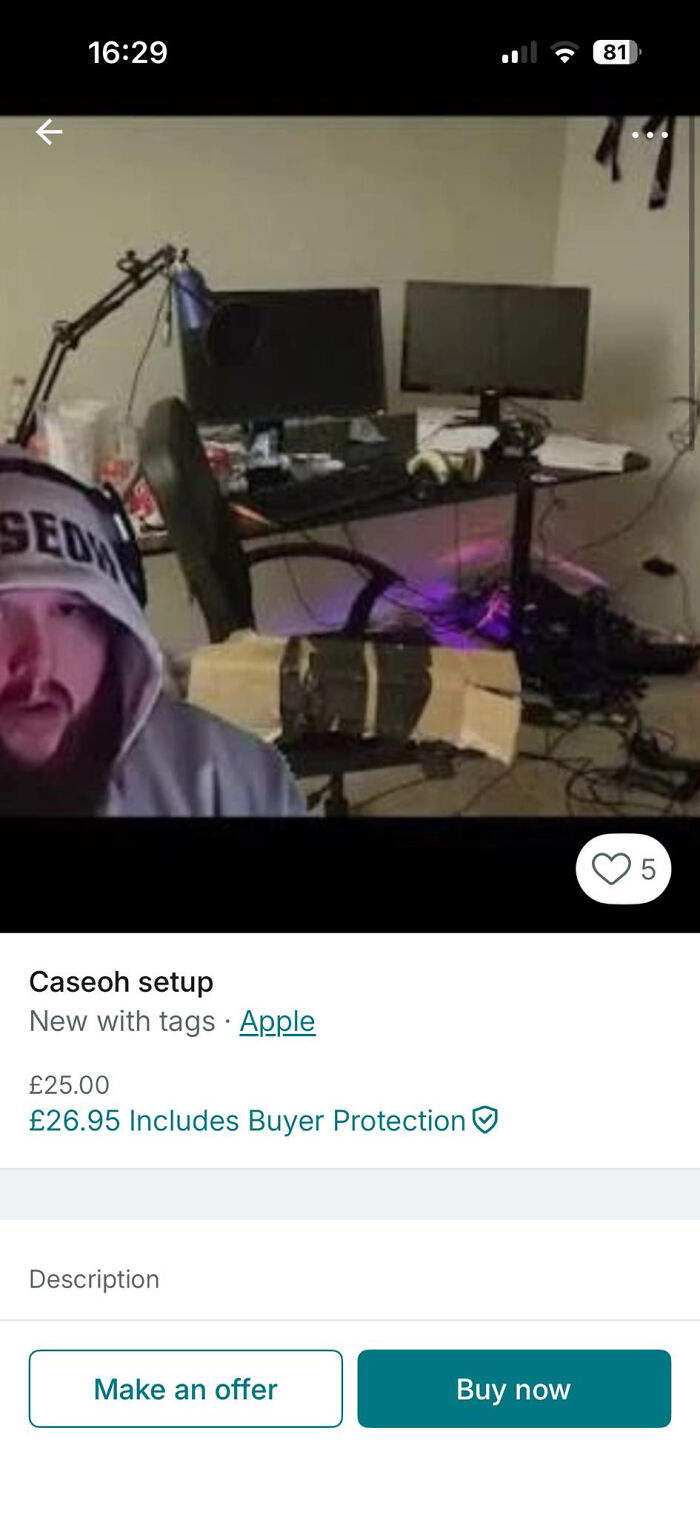 Cluttered home computer setup with dual monitors, headphone mic arm, and a person wearing a hoodie in a Vinted post.