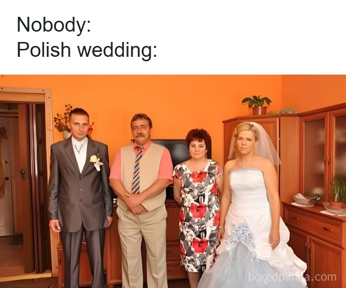 Polish wedding family photo with bride, groom, and relatives in an orange room, capturing Eastern Europe humor and culture.