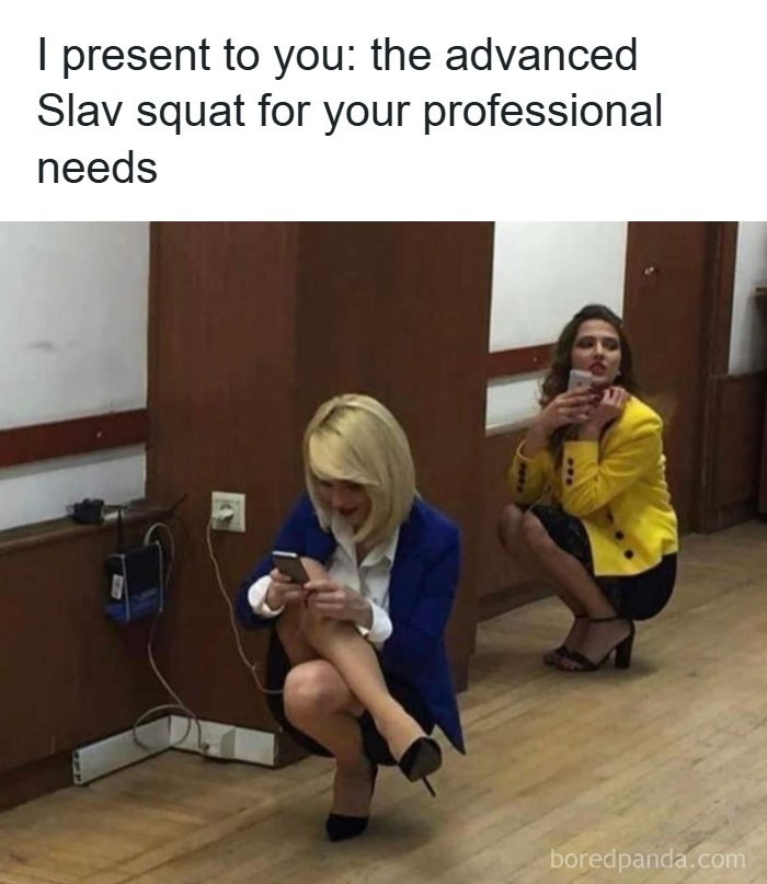 Two women in professional clothes performing the advanced Slav squat indoors, a relatable Eastern Europe meme.