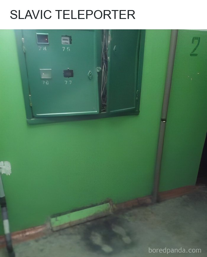 Burnt floor marks in front of an electrical panel inside an old green apartment hallway in Eastern Europe.