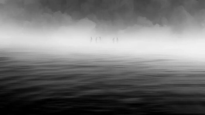 Minimalist black and white photo of calm water blending into mist, showcasing striking minimalism in art photography.