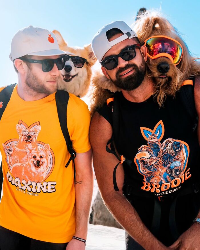 Two men wearing backpacks with dogs inside, showcasing adorable dogs in backpacks enjoying city adventures.