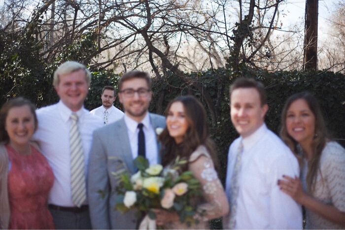 Group of siblings smiling outdoors on a sunny day, showing how life is more fun with siblings in candid family photo.