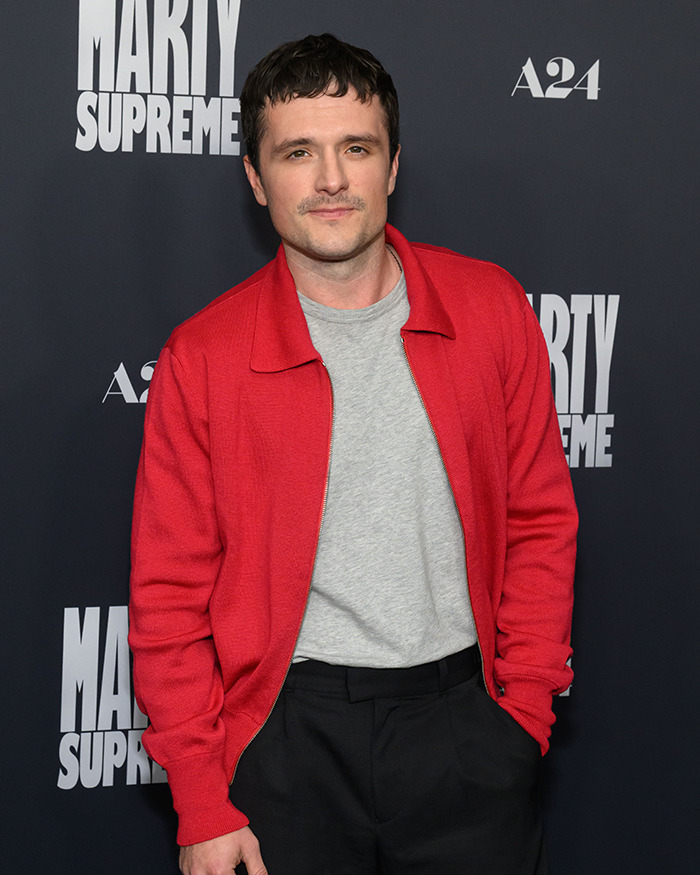 Josh Hutcherson posing at a movie premiere wearing a red jacket and gray shirt, linked to Taylor Swift snarky comment debate. Josh Hutcherson posing at a movie premiere wearing a red jacket and gray shirt, linked to Taylor Swift snarky comment debate.
