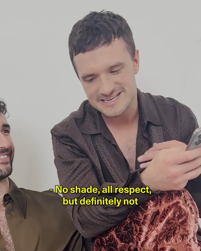 Josh Hutcherson speaking with a smile, holding a phone, sparking fierce debate online about Taylor Swift. Josh Hutcherson speaking with a smile, holding a phone, sparking fierce debate online about Taylor Swift.