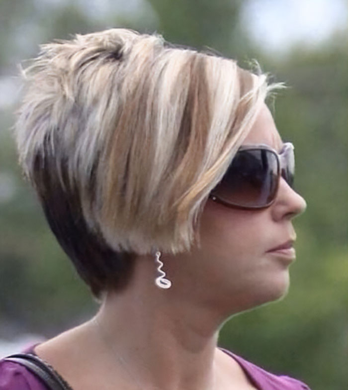 Profile of a woman with a modern short blonde hairstyle and sunglasses symbolizing the end of the Karen era. Profile of a woman with a modern short blonde hairstyle and sunglasses symbolizing the end of the Karen era.