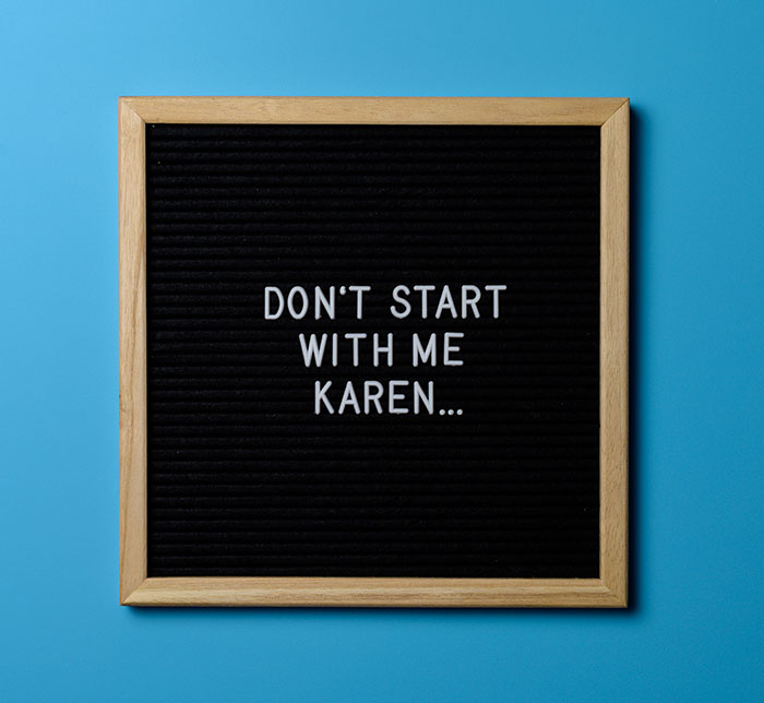 Black felt letter board with wooden frame reads "Don't start with me Karen" on a blue background referencing Karen era and Gen Z trends. Black felt letter board with wooden frame reads "Don't start with me Karen" on a blue background referencing Karen era and Gen Z trends.