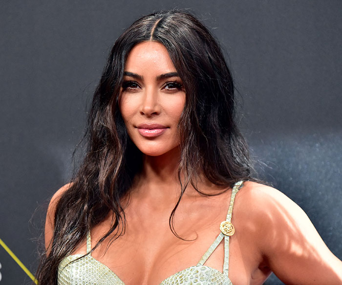 Kim Kardashian attending an event, highlighting her struggle to accept low brain activity after a medical scan. Kim Kardashian attending an event, highlighting her struggle to accept low brain activity after a medical scan.