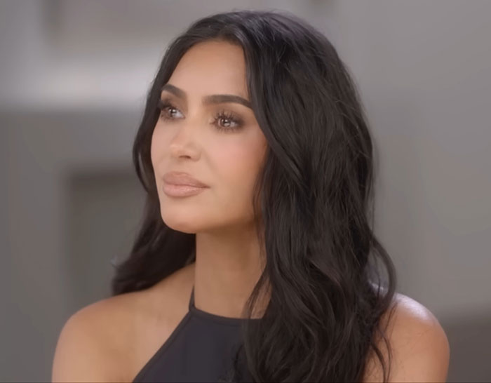Kim Kardashian with long dark hair, reflecting on low brain activity after medical scan in an indoor setting. Kim Kardashian with long dark hair, reflecting on low brain activity after medical scan in an indoor setting.