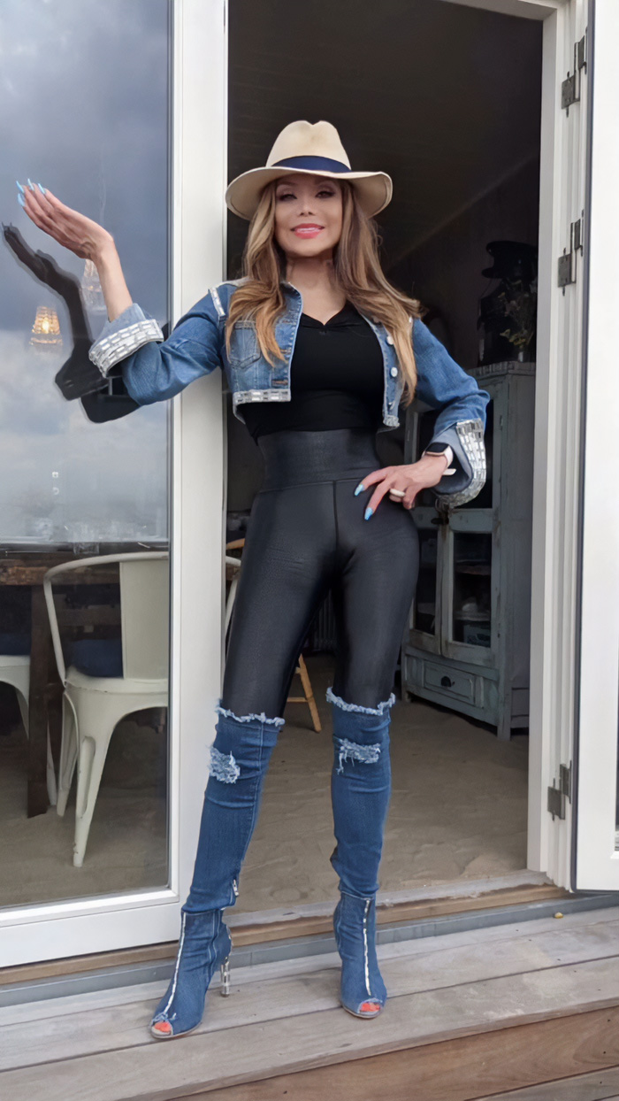La Toya Jackson posing outdoors in slim appearance wearing denim jacket, hat, and high-waisted leggings amid health concerns.