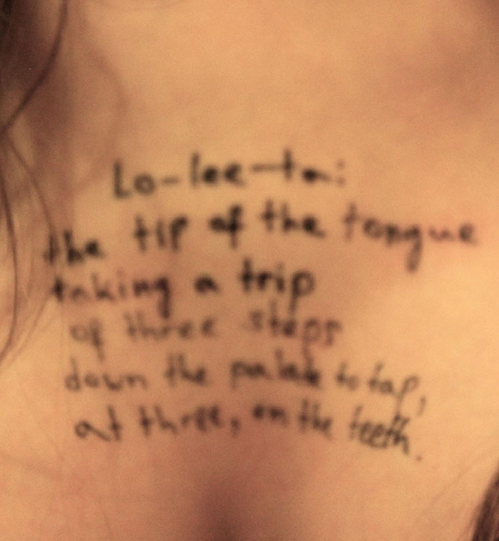 Close-up of a woman’s chest showing handwritten disturbing messages from new Epstein files photos. Close-up of a woman’s chest showing handwritten disturbing messages from new Epstein files photos.