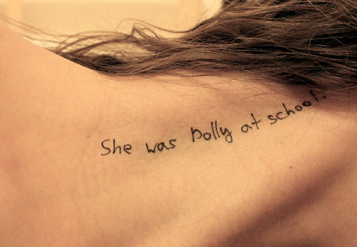 Close-up of a woman's shoulder with disturbing handwritten messages, related to new Epstein files photos. Close-up of a woman's shoulder with disturbing handwritten messages, related to new Epstein files photos.