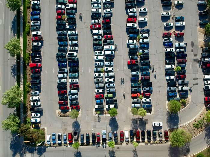 Aerial view of a parking lot showing small design mistakes in layout that create annoying inefficiencies.