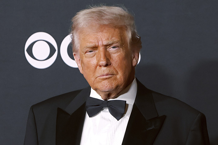 Man in a black tuxedo with bow tie at a formal event, related to Maria Shriver Kennedy Center renaming controversy online. Man in a black tuxedo with bow tie at a formal event, related to Maria Shriver Kennedy Center renaming controversy online.