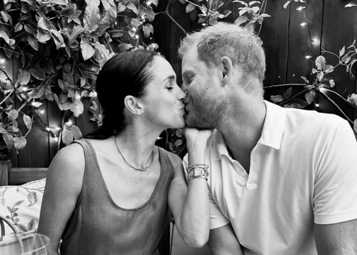 Meghan Markle and Prince Harry sharing a candid moment amid reports of publicist quitting their team.