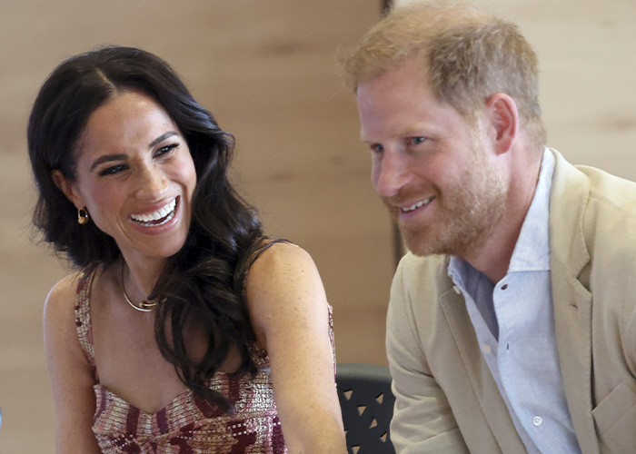 Meghan Markle and Prince Harry engaged in conversation, highlighting the publicist changes in their team.
