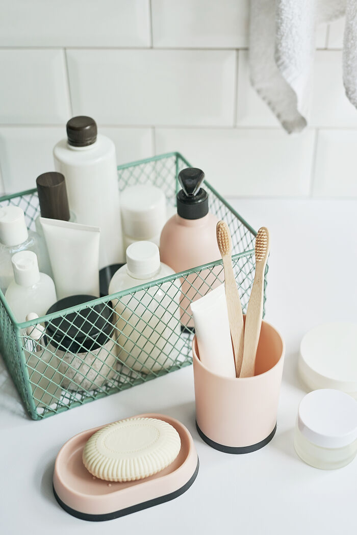 Bathroom essentials including toothbrushes and personal care bottles, reflecting men’s insights on women from relationships.