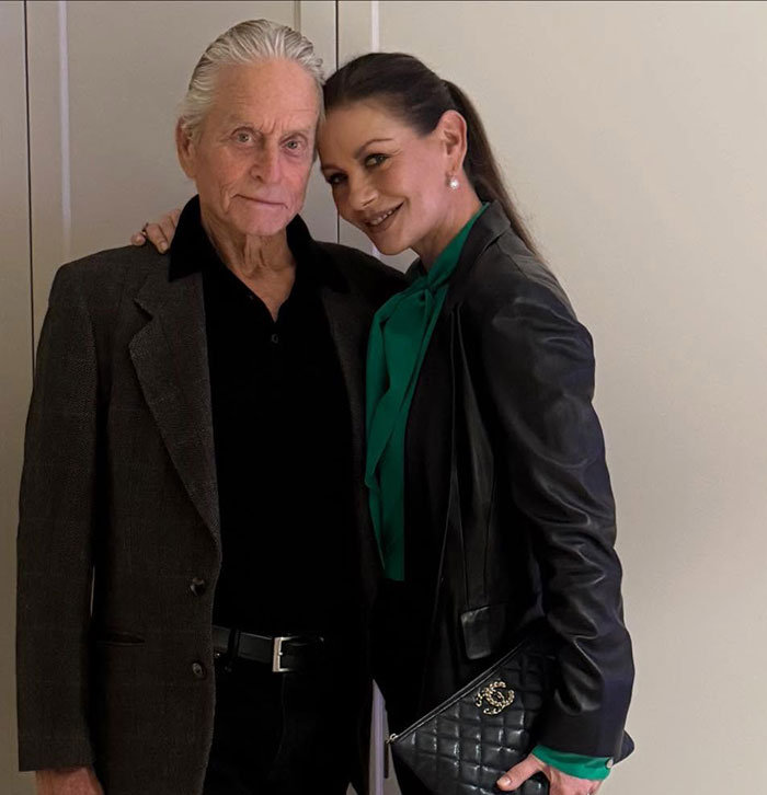 Michael Douglas and Catherine Zeta-Jones posing together, related to nepo baby son&rsquo;s debate flop controversy.