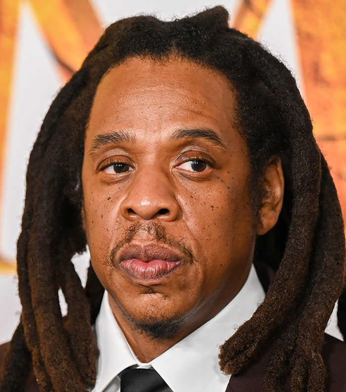 Close-up of a male celebrity with dreadlocks at an event representing the most disliked stars of this year voted by people.