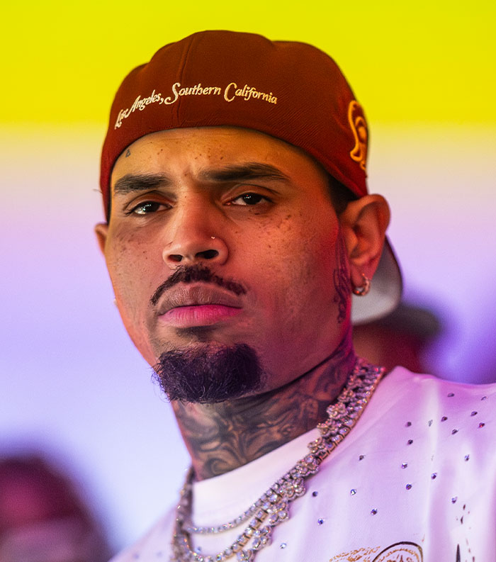 Man wearing a red cap and diamond chains, representing one of the most disliked stars in the popular vote this year.