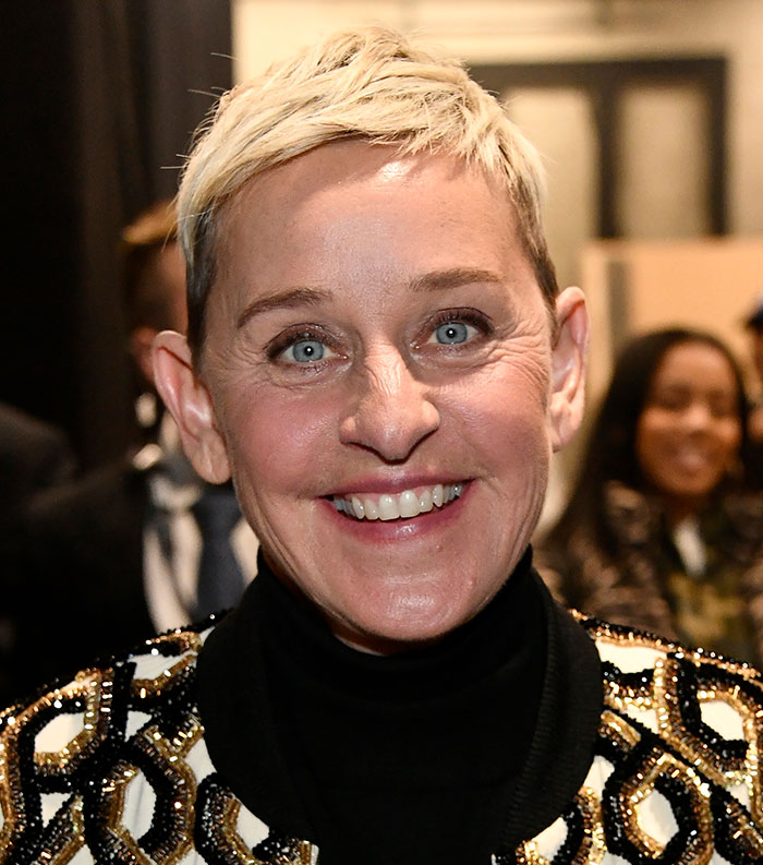 Close-up of a smiling star with short blonde hair, featured among the 50 most disliked stars of this year voted by people