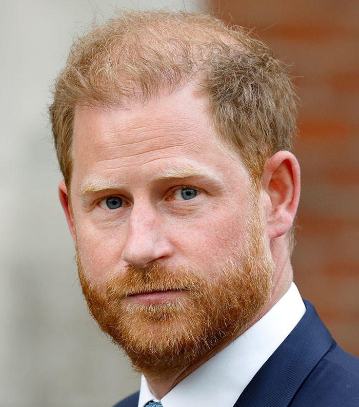 Close-up portrait of a red-haired man in a suit, representing one of the most disliked stars this year by public vote.