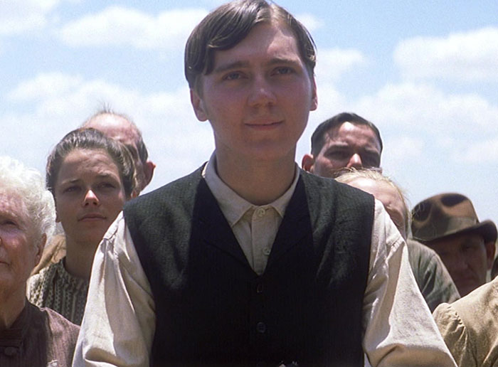 Young male actor in period costume surrounded by crowd, representing Quentin Tarantino's comments on weakest male actor controversy. Young male actor in period costume surrounded by crowd, representing Quentin Tarantino's comments on weakest male actor controversy.