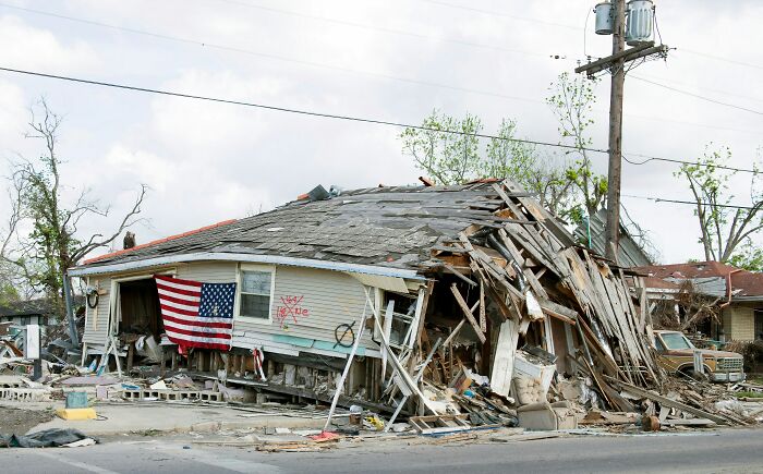 Severe storm damage showing a collapsed house with an American flag, a haunting scene people still talk about as scary.
