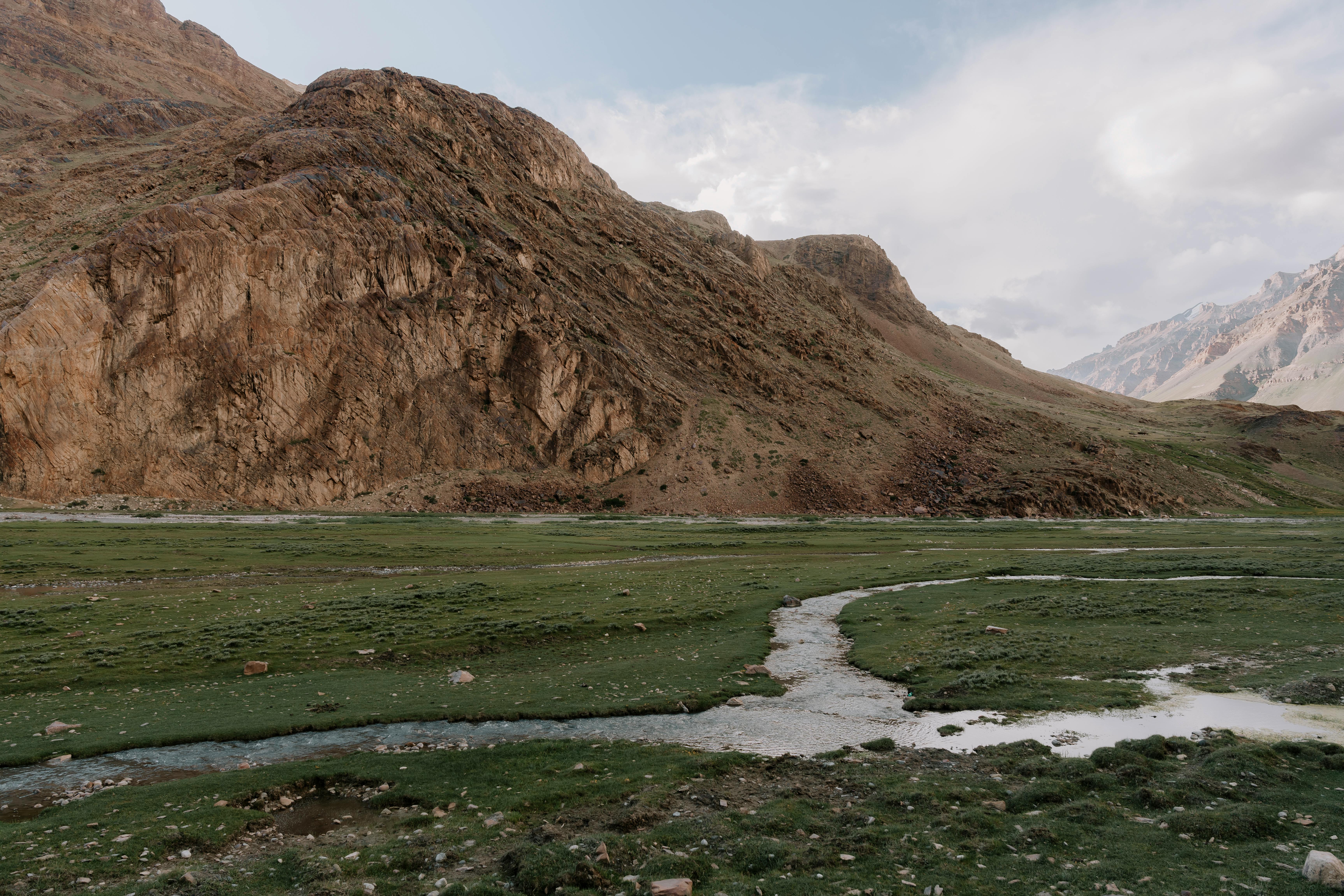 Rocky mountains and winding river in hidden gems of Himachal Pradesh showcasing nature&rsquo;s finest wonders and serene landscape.