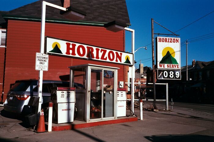 Old gas station with Horizon sign on a sunny day, evoking unresolved mysteries people carry with them.