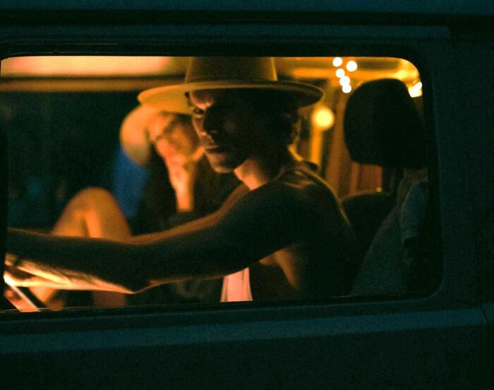 Two people in a dimly lit van, capturing a moment when people instinctively felt something was wrong and needed to leave.