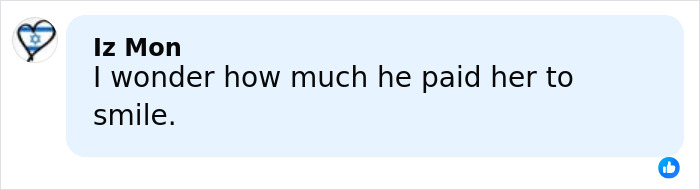 Comment on social media post saying "I wonder how much he paid her to smile" shown on a light blue background. Comment on social media post saying "I wonder how much he paid her to smile" shown on a light blue background.