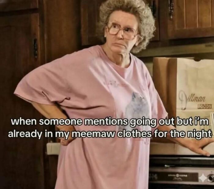 Older woman in a pink shirt with glasses, standing with hand on hip, showing a funny meme about relaxing clothes.
