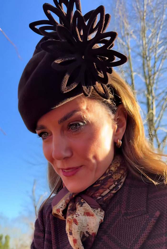 Kate Middleton wearing a brown hat and scarf during Christmas appearance, sparking scar and cancer conspiracy theories.
