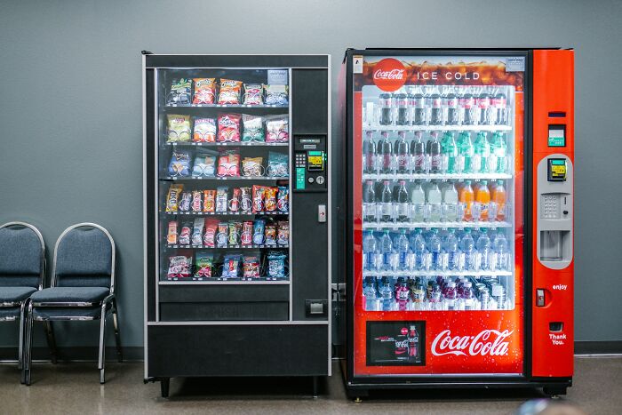 Two vending machines stocked with snacks and drinks in a breakroom, symbolizing stories from folks who quit jobs quickly.