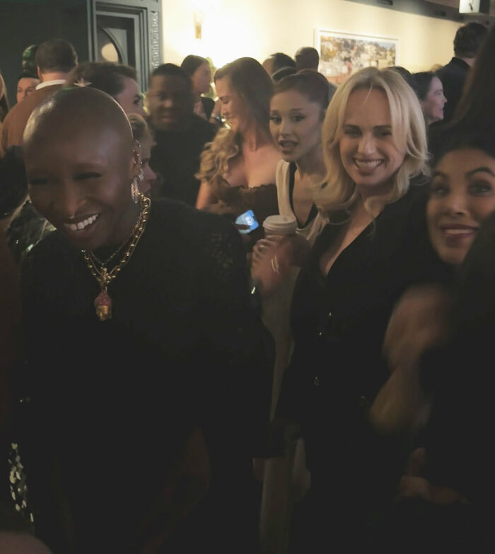 Rebel Wilson and Ariana Grande at a crowded event with people noticing a bizarre detail in the shared photo.