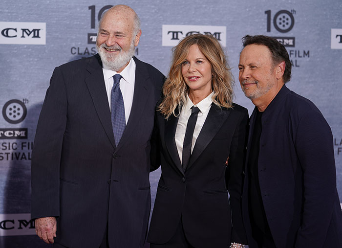 Billy Crystal with Rob Reiner and a female companion at a film festival event, smiling in front of a branded backdrop. Billy Crystal with Rob Reiner and a female companion at a film festival event, smiling in front of a branded backdrop.