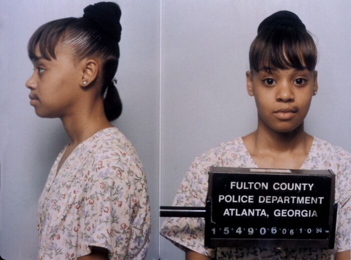 Young woman posing for a Fulton County mugshot photo in Atlanta, Georgia, part of celeb mugshot collection after arrest.