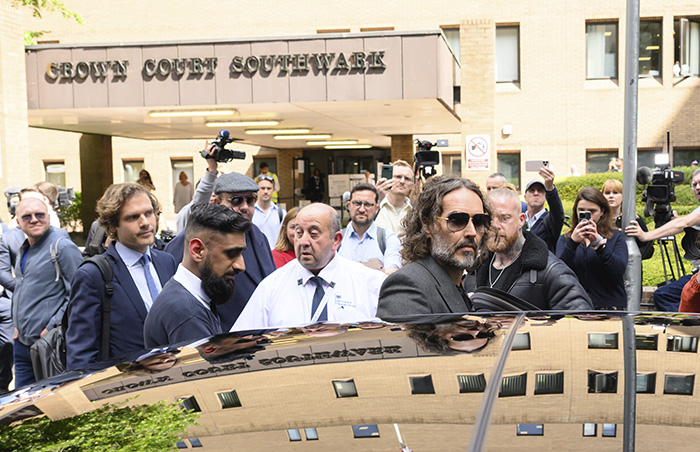 Russell Brand outside Crown Court Southwark amid media, showing a bitter reaction to ex-wife Katy Perry&rsquo;s new relationship news.