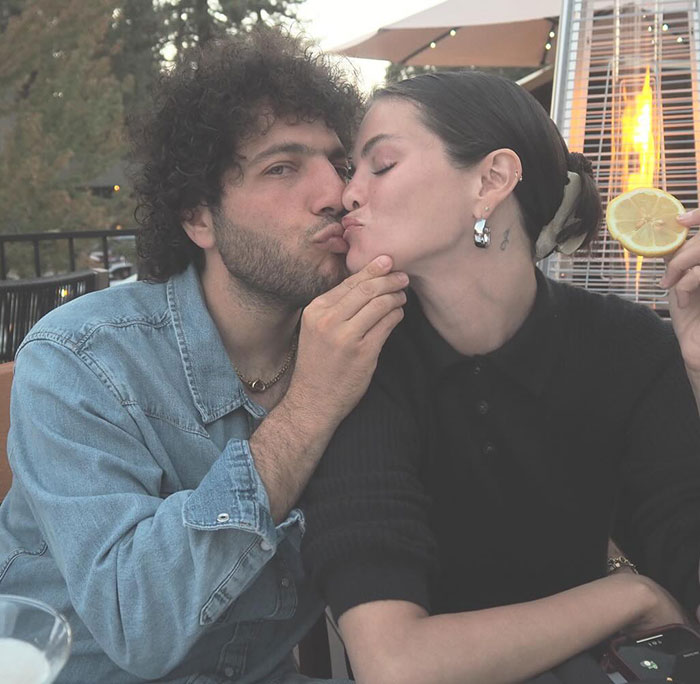 Benny Blanco and Selena Gomez sharing a close moment outdoors, highlighting fans' reactions to their viral clip. Benny Blanco and Selena Gomez sharing a close moment outdoors, highlighting fans' reactions to their viral clip.