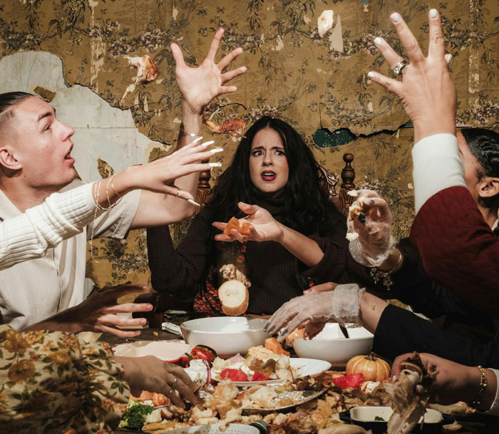 Group at chaotic Thanksgiving dinner, sister&rsquo;s barefoot spiritual advisor causing commotion and distress around the table